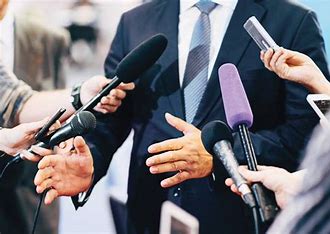 a group of people holding microphones